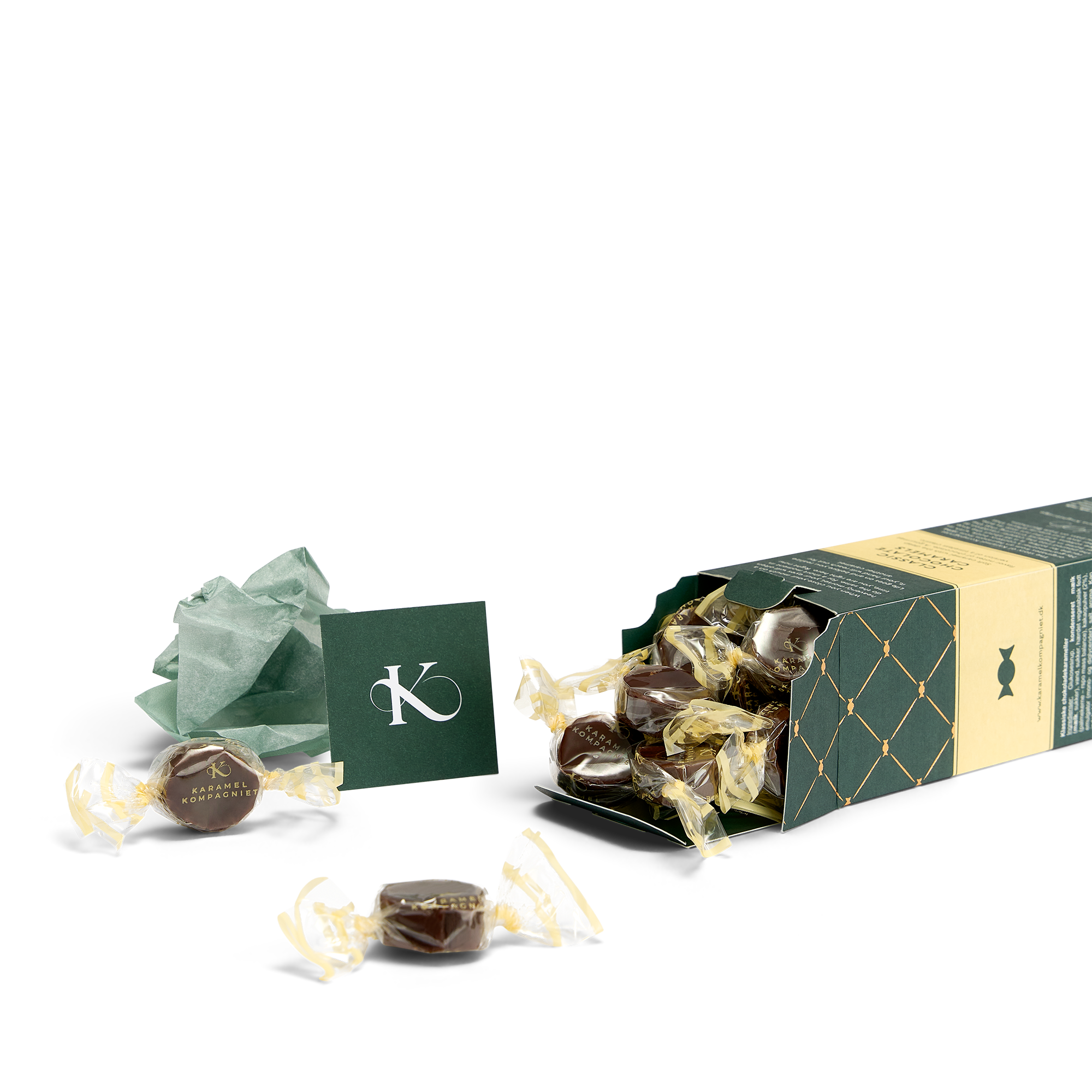 Chokoladekarameller i æske, der ligger ned med karameller der flyder ud