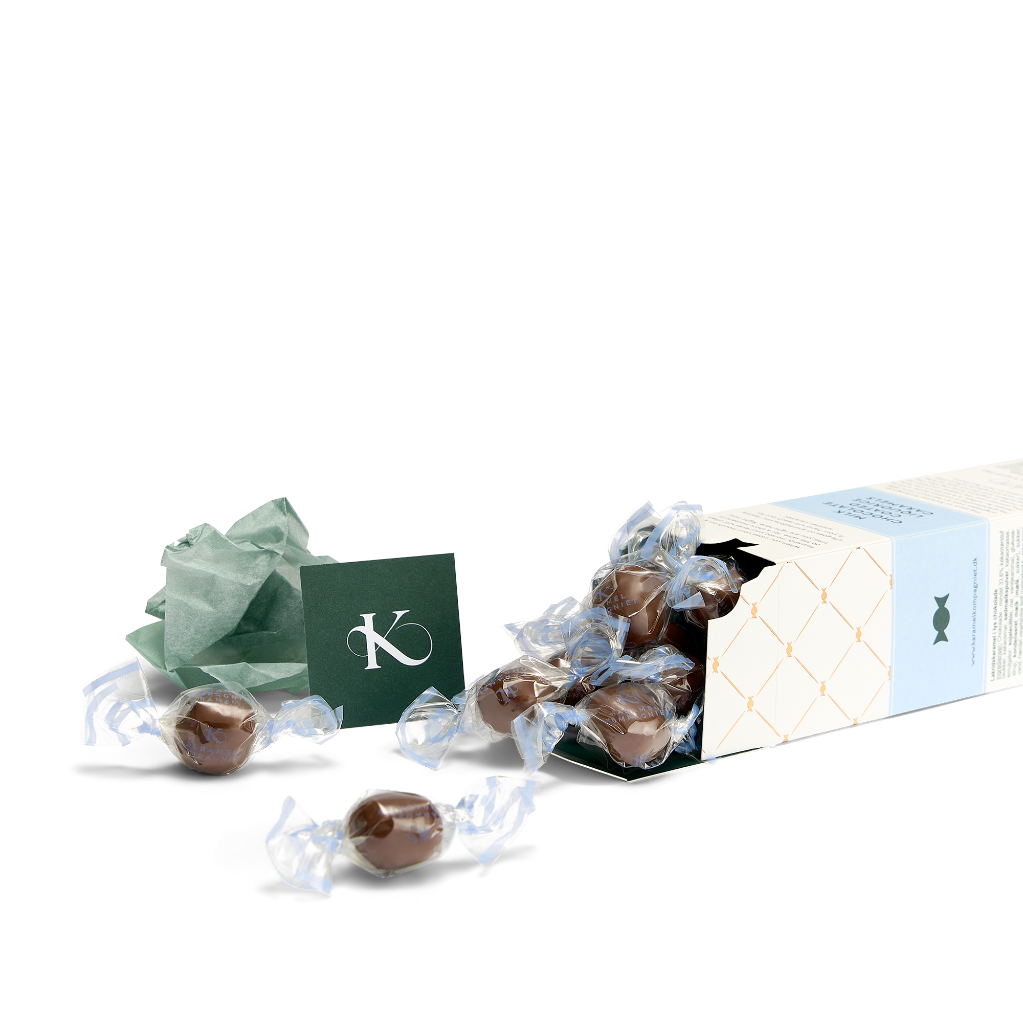 Chokoladeovertrukne Lakridskarameller i æske der ligger ned med karameller der flyder ud