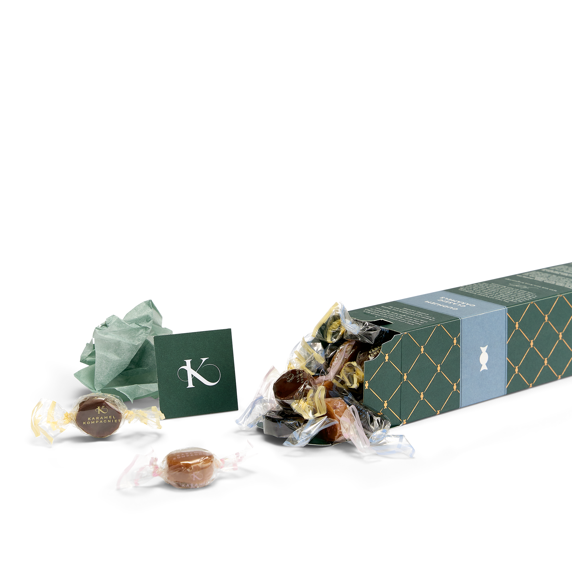 Klassisk karamelblanding fra Gudhjem i æske, liggende ned med karameller flydende ud