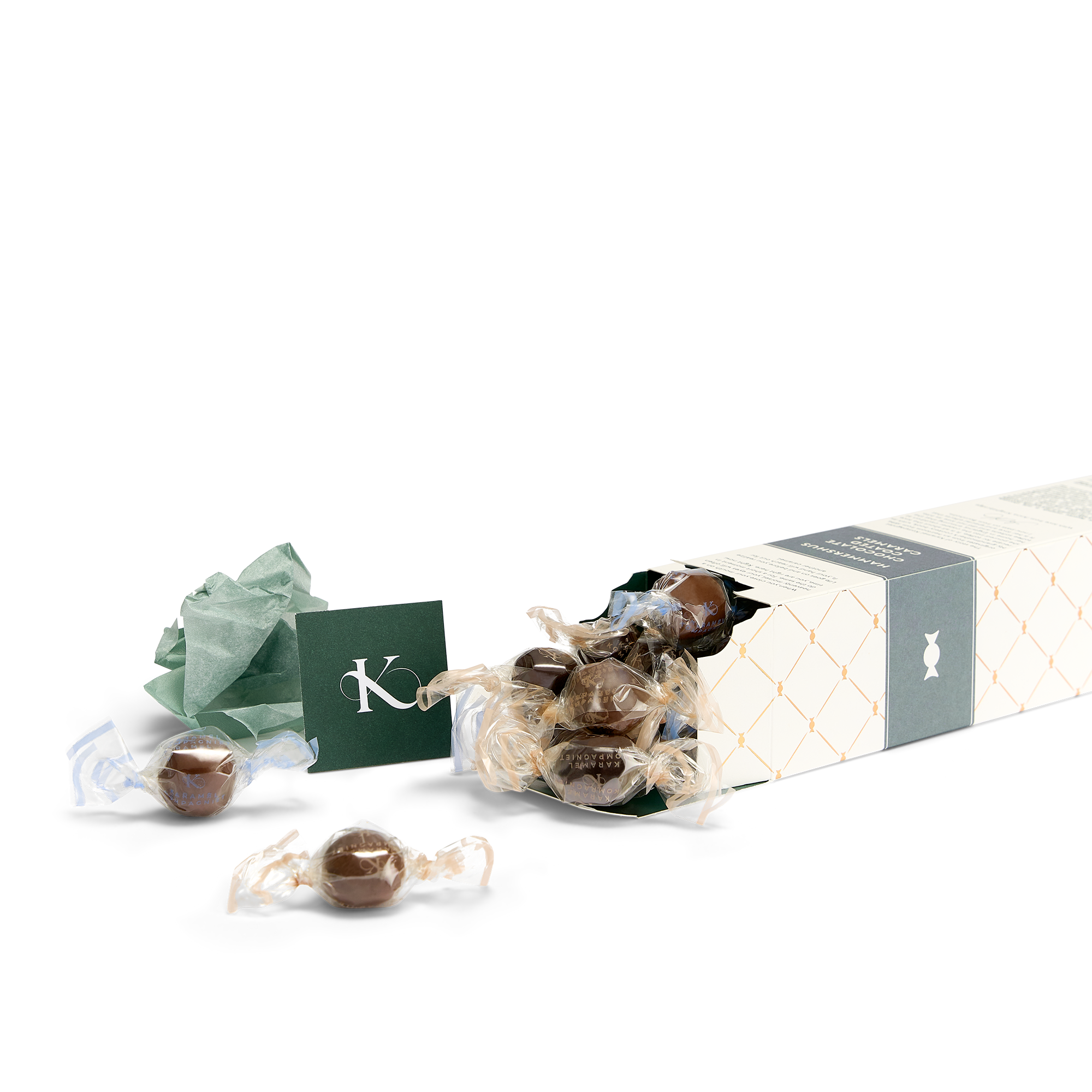 Hammershus – Chokoladeovertrukne Karamel Kugler i flere varianter i highlight-æske, der ligger ned med karamel kugler der flyder ud